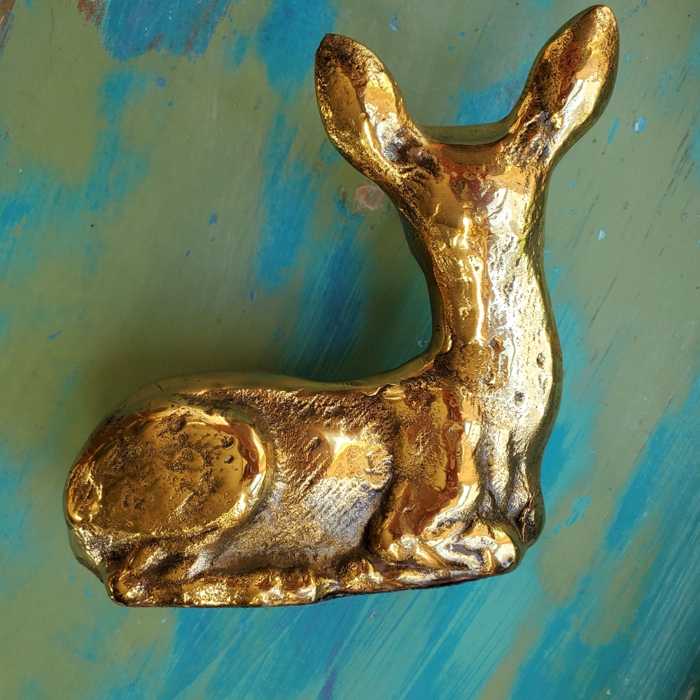 Brass sitting fawn sculpture